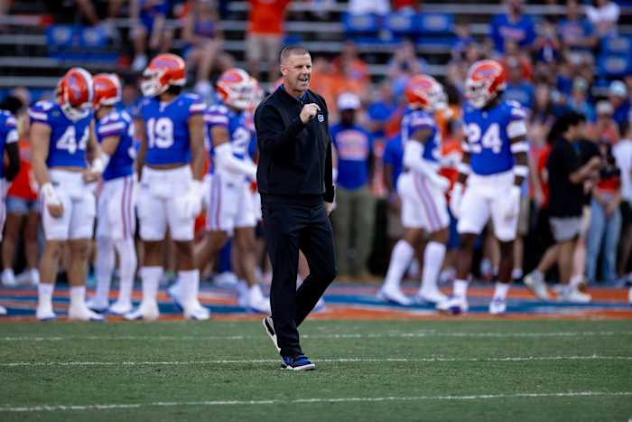 Florida Gators head coach Billy Napier cheers before the game.